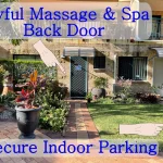 Directional signage for the rear entrance at Joyful Massage & Spa