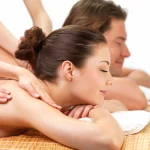 Side-by-side couples massage treatment in a private room