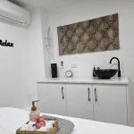 Private massage treatment room three with ambient lighting